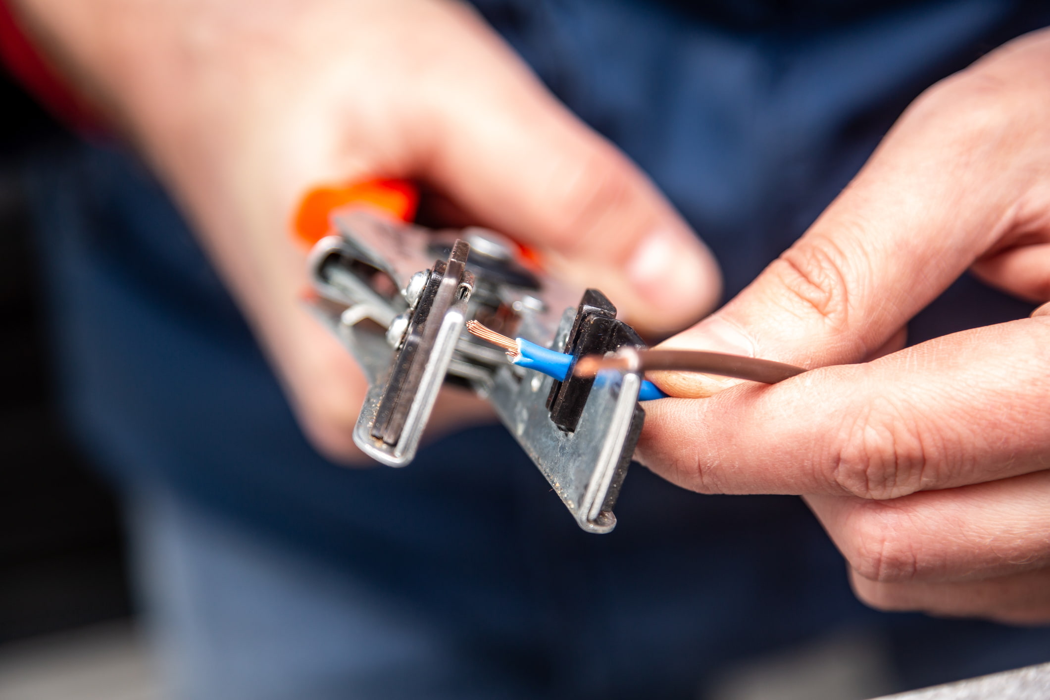 An electrician snipping wires